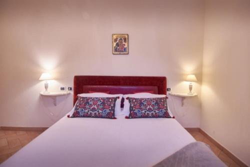 A bed or beds in a room at Alle Porte di Assisi