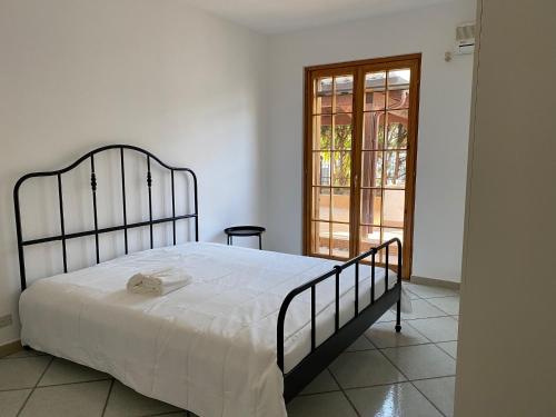 Katil atau katil-katil dalam bilik di Superbe villa à Porto empedocle