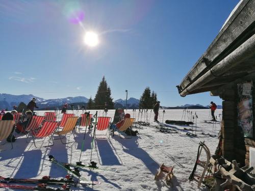 a group of chairs in the snow on a ski slope at Ferienwohnung Prent WILD024 by FeWo-PLAN in Dorf
