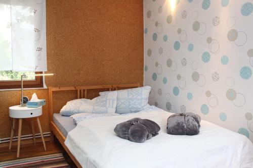 a bedroom with a bed with a backpack on it at Dat Huuske in Gerdau