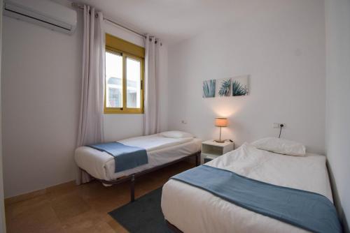 En eller flere senge i et værelse på Ref 233