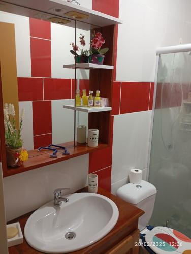 a bathroom with a sink and a shower and a toilet at Appartement N01 T3 in Oiapoque