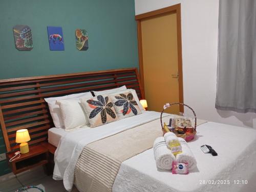 a bedroom with two beds with towels on them at Appartement N01 T3 in Oiapoque