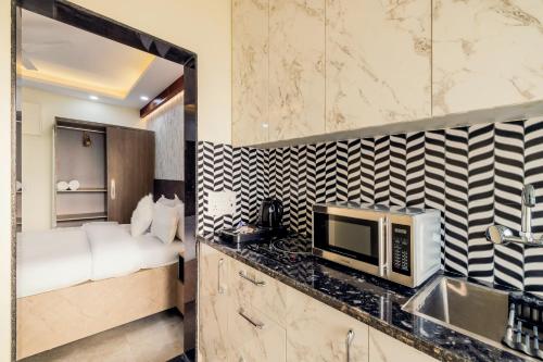 Kuchyň nebo kuchyňský kout v ubytování Kyomi Service Apartments