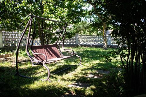 a swing hanging from a tree in a yard at B&B Pervinca in Rocca Grimalda
