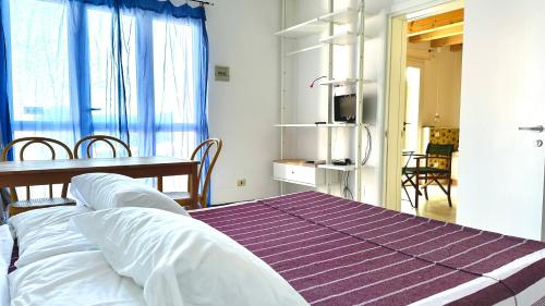 Ένα ή περισσότερα κρεβάτια σε δωμάτιο στο Residence "Le Palme"