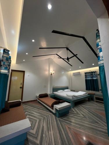 a bedroom with two beds in a room at Amrapali Resort in Top
