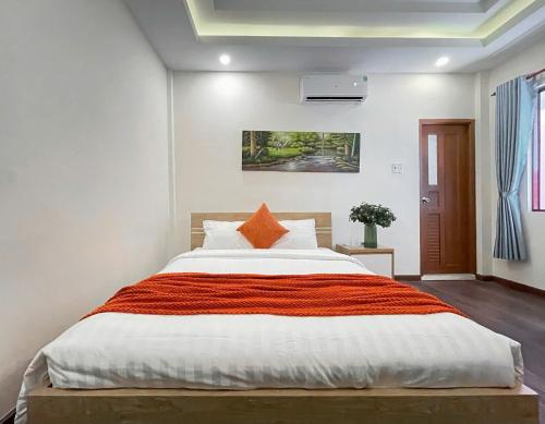 Postel nebo postele na pokoji v ubytování Joi Boutique Bãi Trước