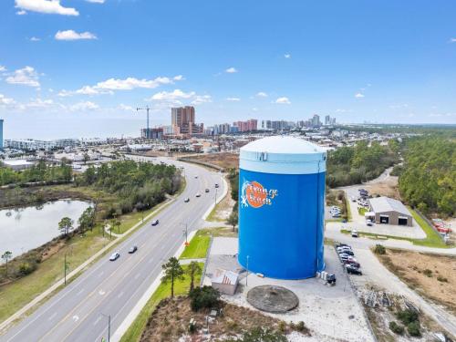 a large blue water tank next to a highway at The Oasis at Orange Beach 2006 (Phoenix West II) in Orange Beach