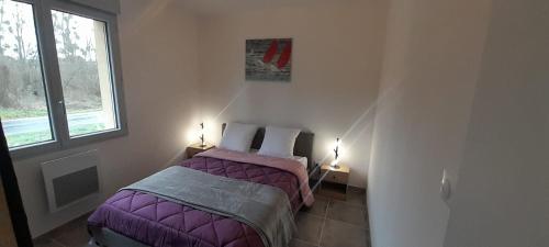 a bedroom with two beds and a window at Maison neuve 14km beauval jardin wifi PMR in Valençay
