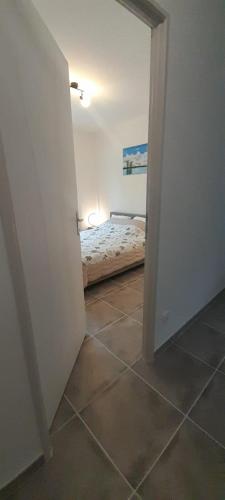 a room with a bedroom with a bed in it at Maison neuve 14km beauval jardin wifi PMR in Valençay