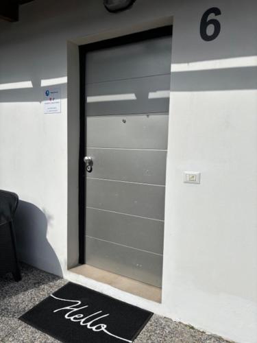 a garage door with the number on it at Mambo House in Milan