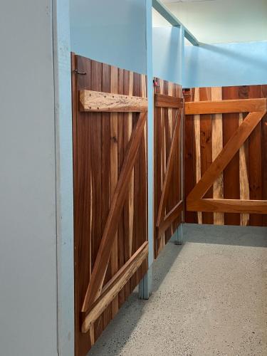 a room with wooden doors in a house at D's Inn in San Ignacio
