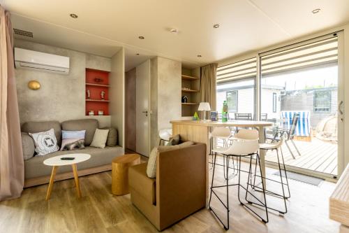 a living room with a couch and a table at Düne 46 in Scharbeutz