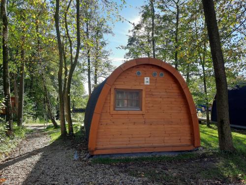 a small igloo house in the woods at 25 Premium Camping Pod "Sylt" in Silberstedt