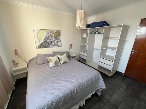 Ένα ή περισσότερα κρεβάτια σε δωμάτιο στο PARANA EDIFICIO CENTURIA Departamento