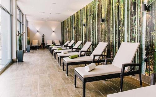 a row of chairs lined up in a waiting room at Ferienhaus Nr 7B2, Feriendorf Hagbügerl, Bayr Wald in Waldmünchen
