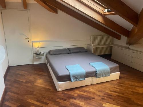 a bedroom with a large bed in a attic at La Mansarda di Pinocchio e dei Lego in Bologna