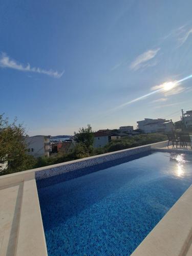 a swimming pool on the roof of a building at Meerblick & Pool in Bar, Susanj