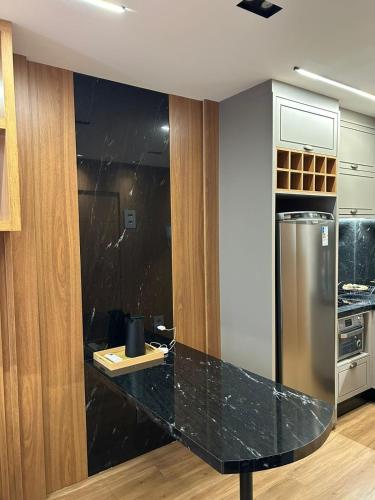 Kuchyň nebo kuchyňský kout v ubytování Studio-Apartamento de Alto Padrao
