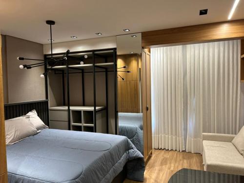 Postel nebo postele na pokoji v ubytování Studio-Apartamento de Alto Padrao