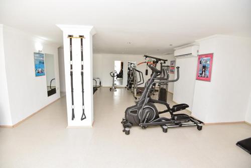 a room with a gym with a exercise bike at Villa Maya The Royal Links Sarigerme in Sarigerme