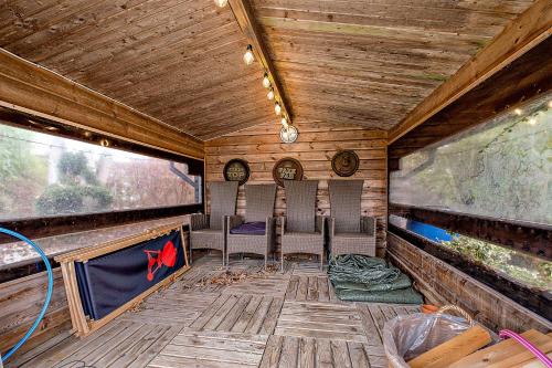 an inside view of a train room with chairs in it at Summer House Near The Sea And Good Experiences in Børkop