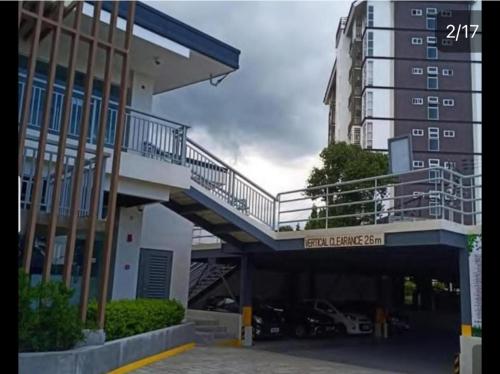 a large building with a ramp to a parking lot at Antara Condomium 2 studio unit in Talisay