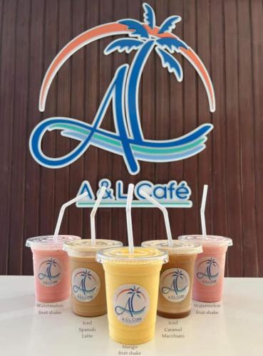 a group of four cups of coffee on a table at A & L Resort - Sea & Mountain View in Looc