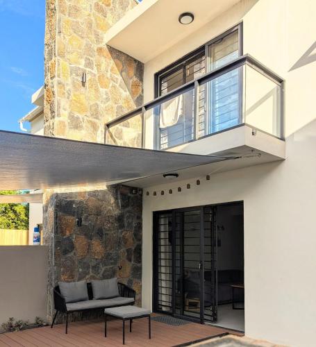 a modern house with a glass facade at Jabali in Roches Noires