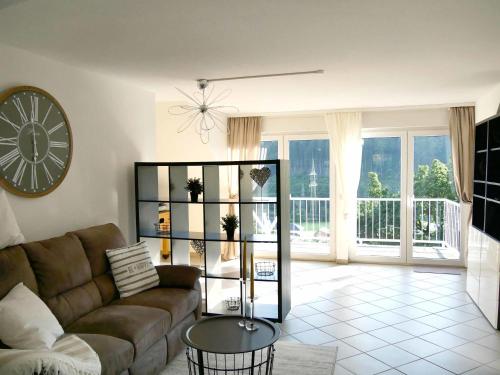 a living room with a couch and a table at Ferienwohnung Lenneblick in Plettenberg