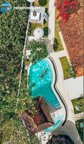 an aerial view of a swimming pool in a backyard at Janur Bungalow in Borobudur
