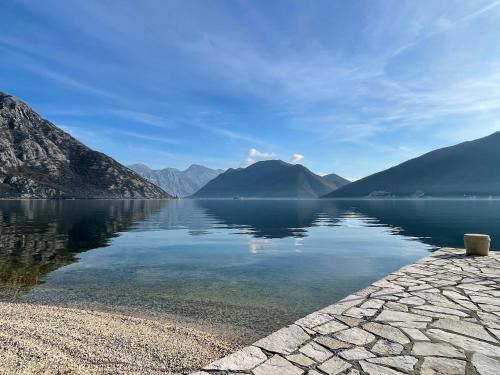 a view of a lake with mountains in the background at Strp House in Strp
