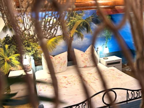 a bedroom with a bed with pillows and plants at Ferienhaus Im Gässchen in Bad Sulza