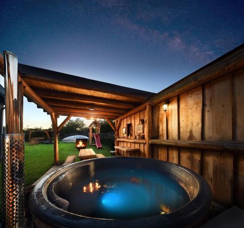a hot tub in the backyard of a house at Andriš Apartmány in Spišské Bystré