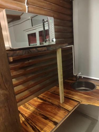 a kitchen with a microwave and a sink at Next Chapter in Great Brak River