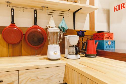 a kitchen counter with two utensils and a blender at Couch Potato Hostel - Vacation STAY 88233 in Matsumoto