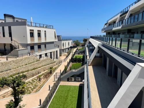 an external view of a building with a courtyard at Gran Alcant Iconic Apartment Riki in Gran Alacant