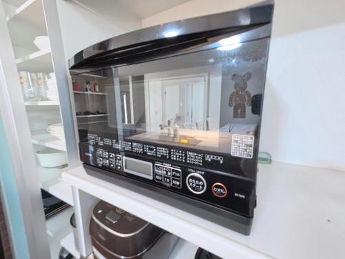 Dapur atau dapur kecil di 霜月simotsuki 最大10人 寝室3 無料駐車場2台分 24Hスーパー1 分 地下鉄心斎橋難波日本橋10分 最寄駅3分