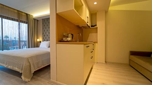 Ένα ή περισσότερα κρεβάτια σε δωμάτιο στο Rooms365