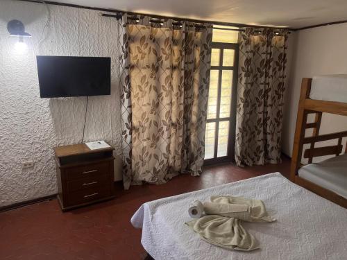 The Chill in Mansion Hostel Santa Martaにあるベッド