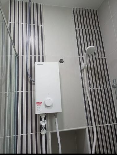 a shower with a white box in a bathroom at Sky Loft Premium Bukit Indah with Garden View & Nflix HBO A30 in Johor Bahru