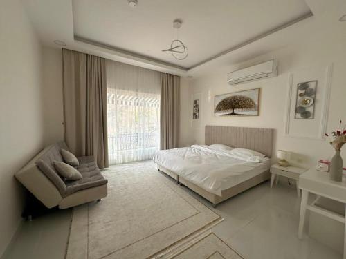 Postel nebo postele na pokoji v ubytování Bandar Hafa