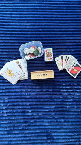 a table topped with cards and a container of food at Oh, Mon Bateau! No running water, bez tekuce vode in Belgrade