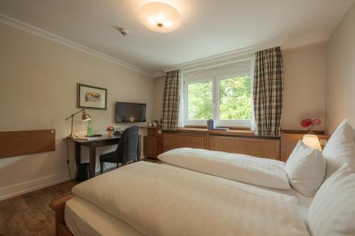 Postel nebo postele na pokoji v ubytování Romantik Hotel Das Lindner