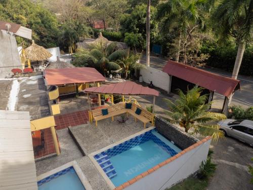 an aerial view of a house with a swimming pool at Hotel Manakin Tayrona in El Zaino