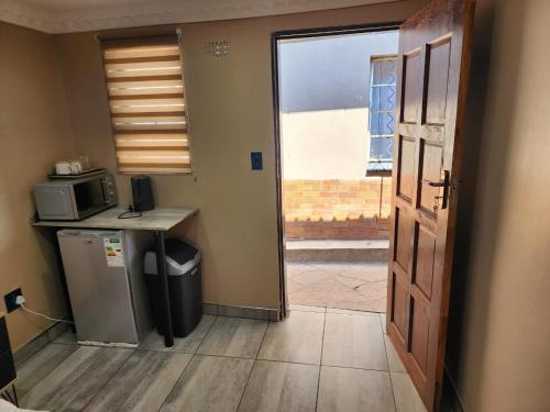 Η κουζίνα ή μικρή κουζίνα στο Arcon Accommodation 12
