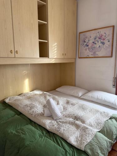 a bed with a blanket on top of it at # Punto FM 9 # in Marghera