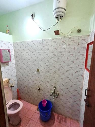 a bathroom with a toilet and a sink at Brewvilla 'Solaris ' in Puducherry