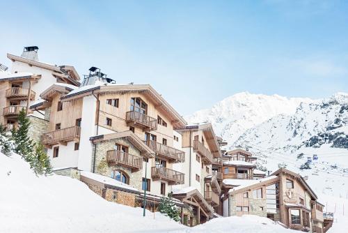 a building on top of a snow covered mountain at Hotel Pashmina Le Refuge in Val Thorens